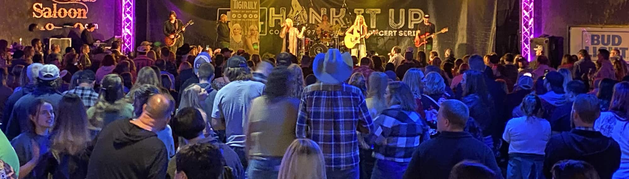 country concert with fans wearing cowboy hats Missoula